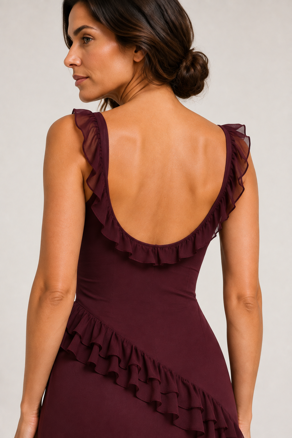 Rear close-up of the dark red dress, showing the ruffled shoulder straps and low back