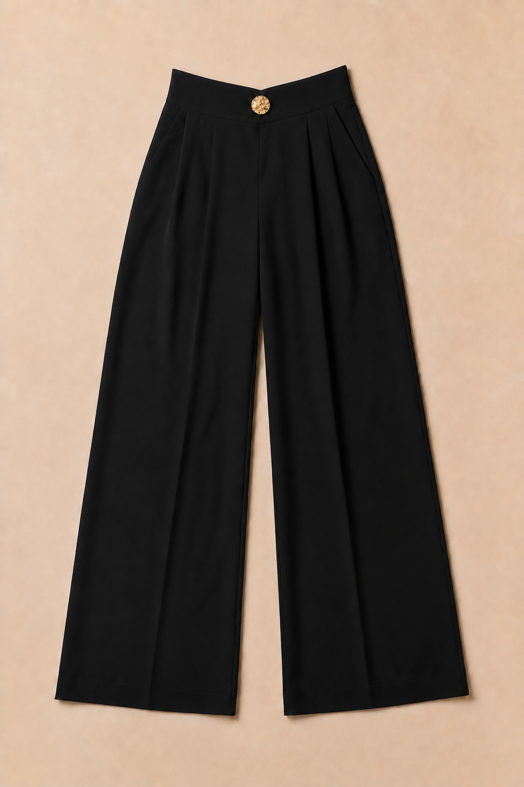 Flat-lay of the black wide-leg trousers showing the small V-shaped waistband