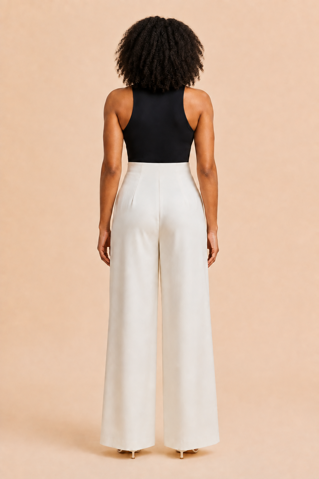 Back view of the white high-waist wide-leg trousers with a smooth closure-free waistband