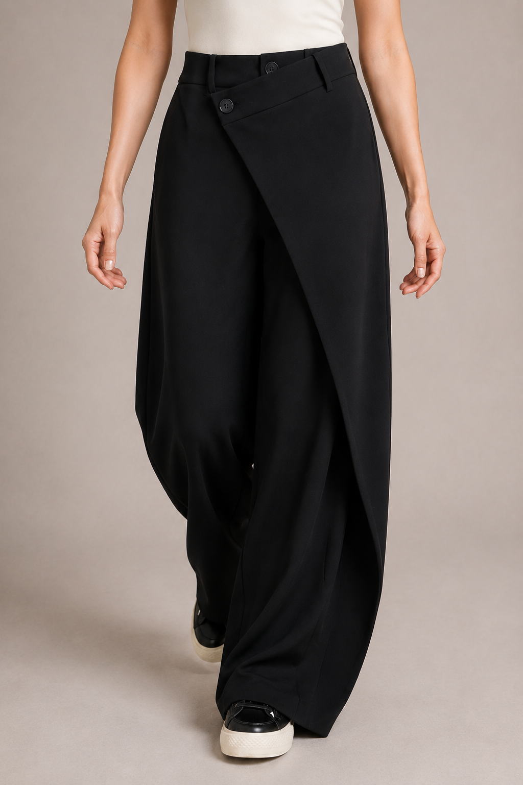 Right-side view of the black asymmetric-waist wide-leg trousers showing the side pocket and full-length drape