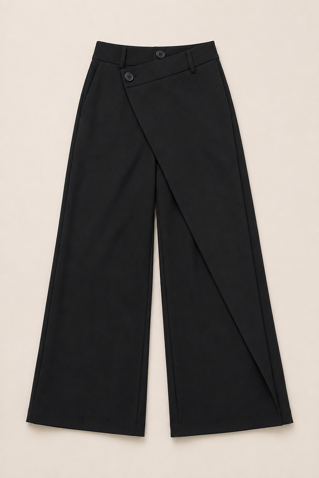 Flat-lay of the black asymmetric-waist wide-leg trousers showing the wrap front and wide legs
