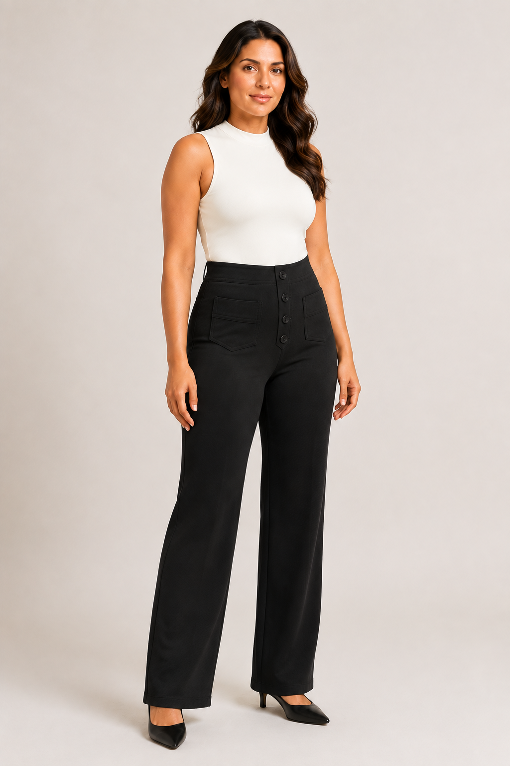 Woman wearing the black button-front high-waisted straight-leg trousers, front three-quarter view