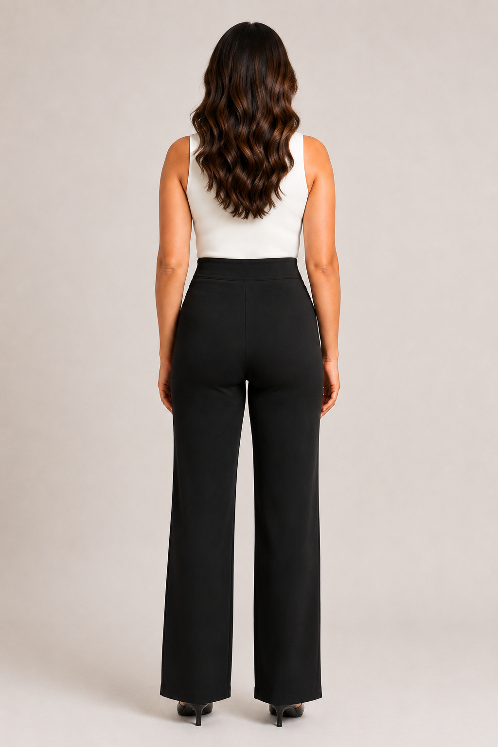Back view of the black high-waisted straight-leg trousers showing the clean waistband and straight legs
