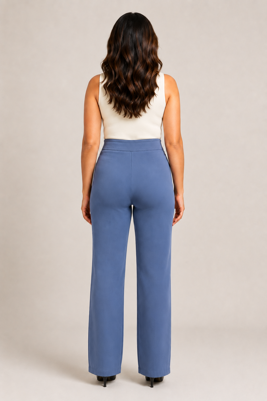 Back view of the blue high-waisted straight-leg trousers showing the clean waistband and straight legs