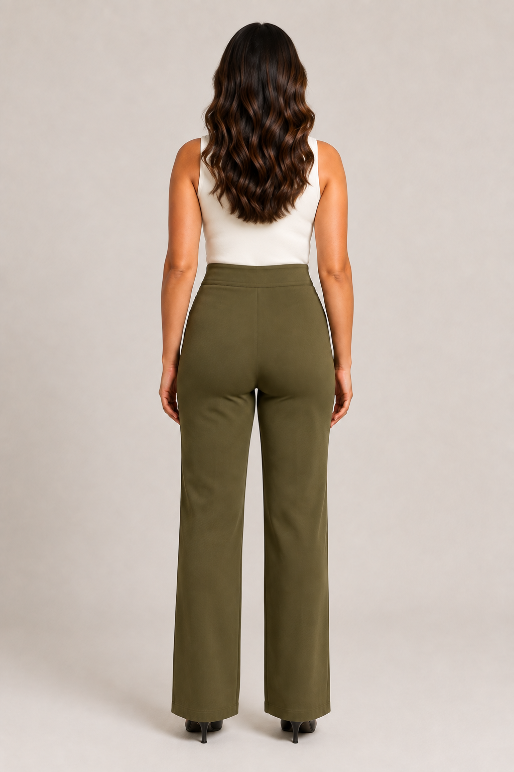 Back view of the green high-waisted straight-leg trousers showing the clean waistband and straight legs