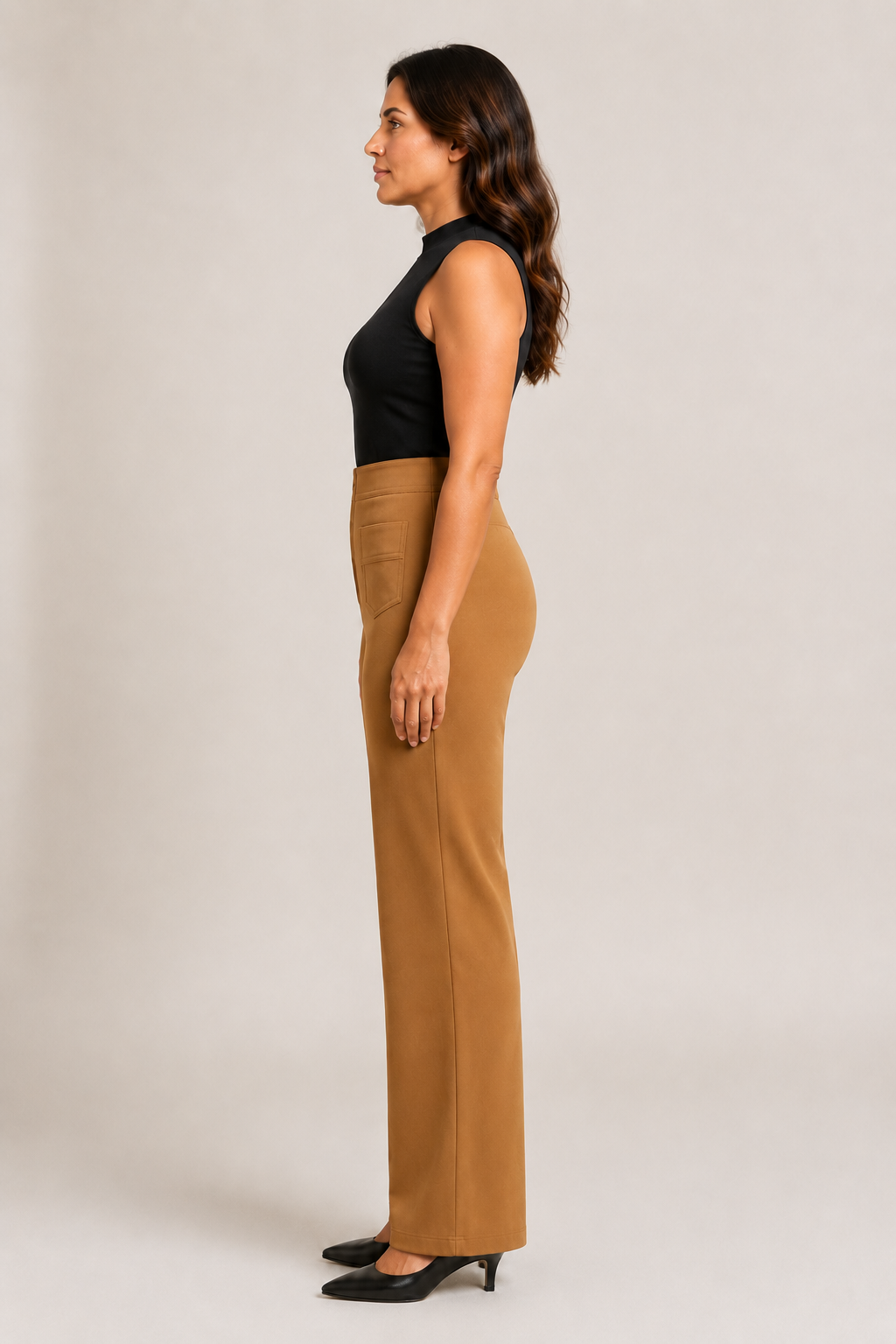 Side view of the khaki high-waisted straight-leg trousers showing the fitted waist and full-length silhouette