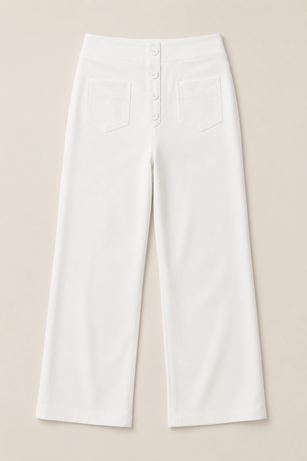 Flat-lay of the white button-front high-waisted straight-leg trousers