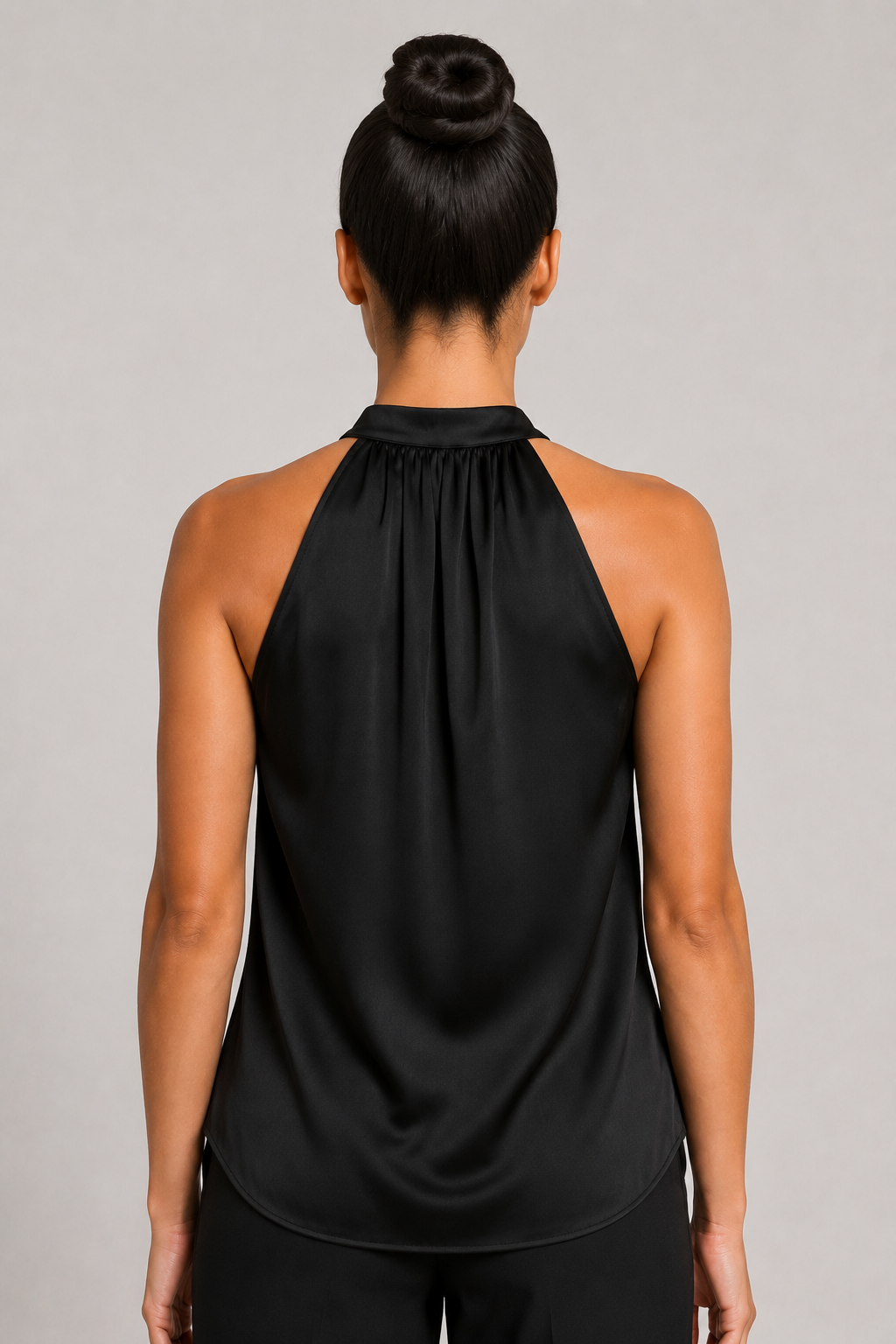 Back close-up of the black blouse showing the broad halter neckline and draped back