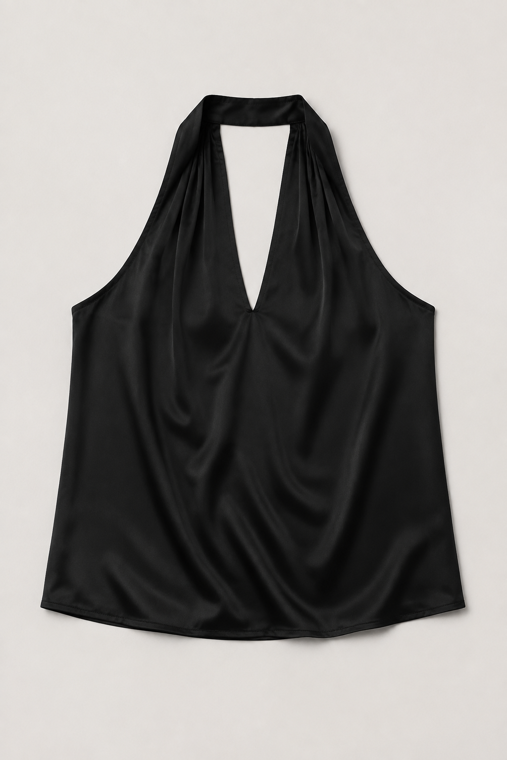 Flat-lay of the black draped halter-neck blouse
