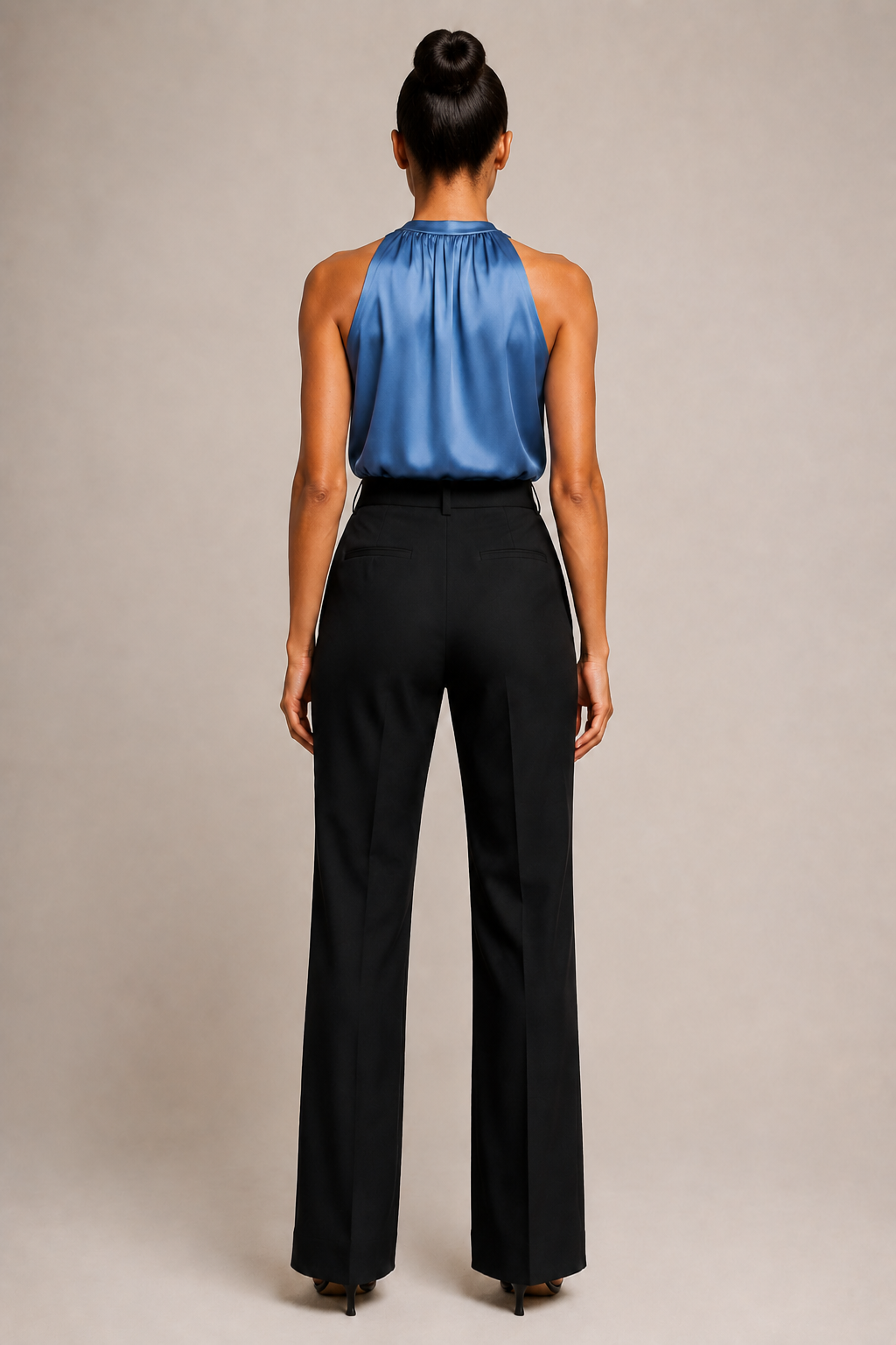 Back view of the blue draped halter-neck blouse