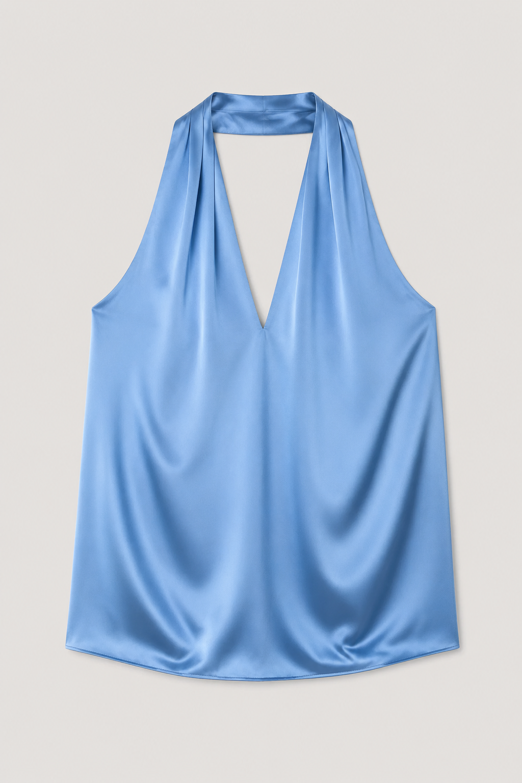 Flat-lay of the blue draped halter-neck blouse