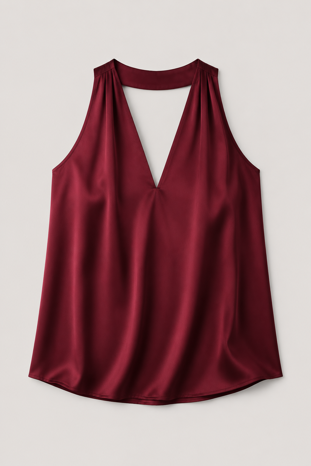 Flat-lay of the burgundy draped halter-neck blouse