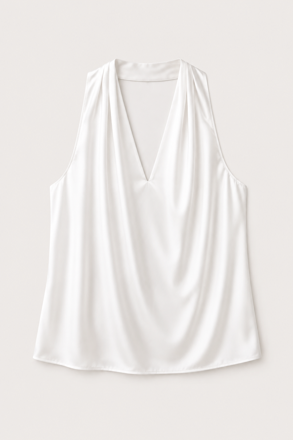 Flat-lay of the white draped halter-neck blouse