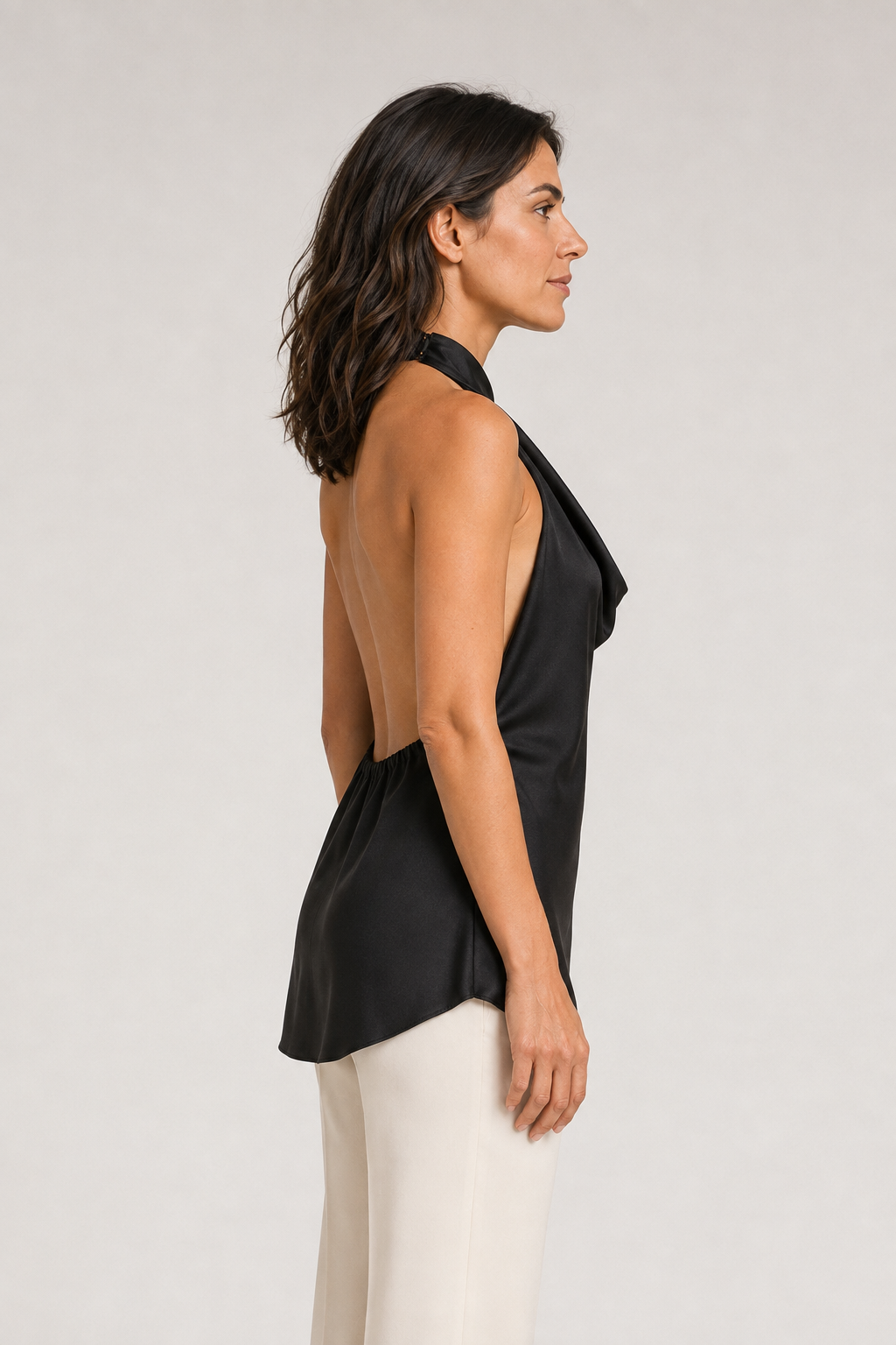 Side view of the black draped open-back halter top