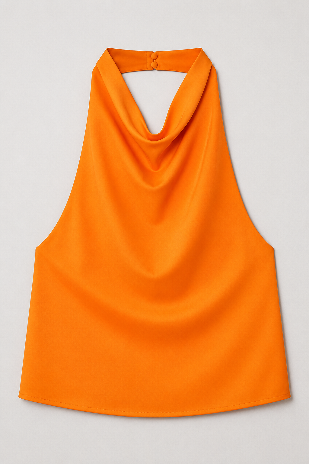 Flat-lay of the orange draped open-back halter top