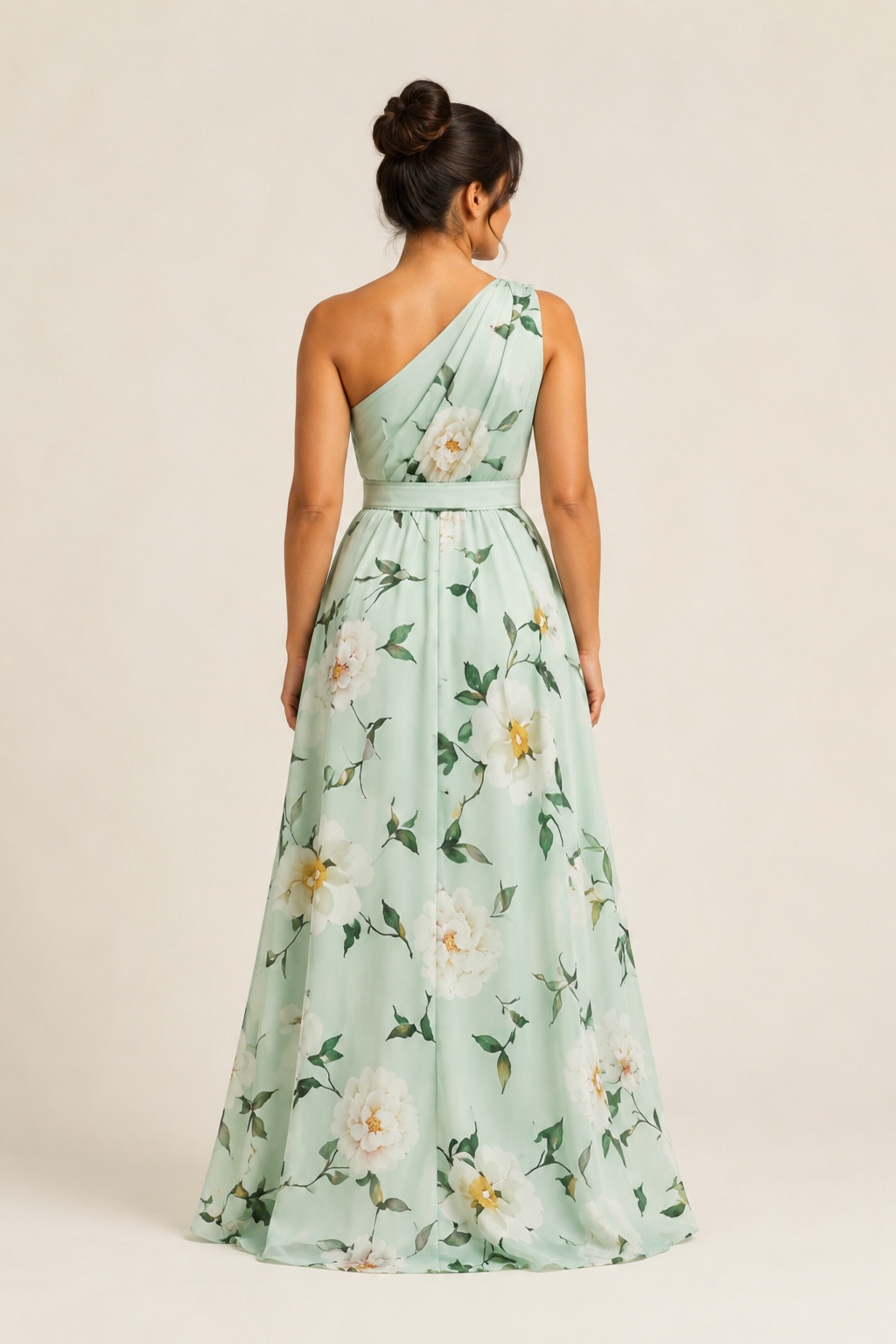Back view of the light green floral one-shoulder maxi dress showing the asymmetric neckline and full skirt
