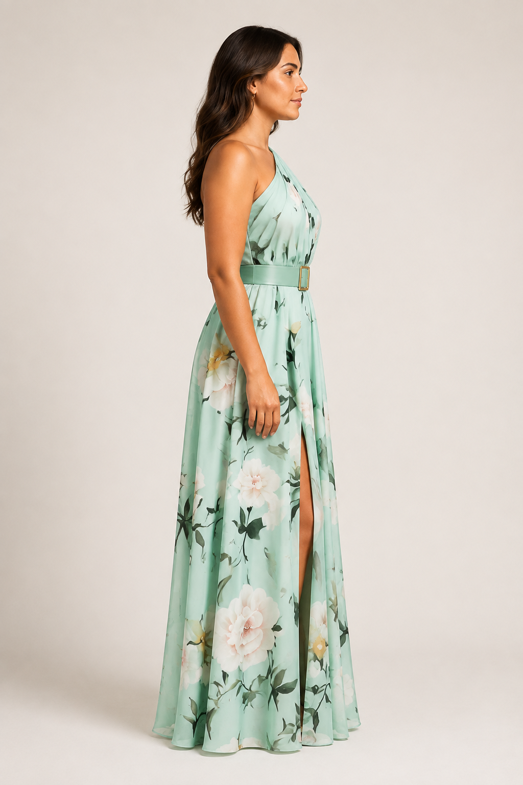 Side view of the light green floral one-shoulder maxi dress showing the belted waist and front split