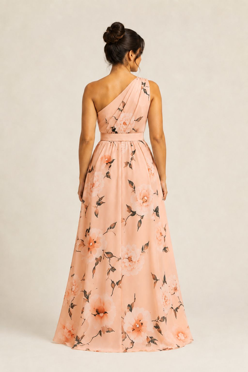 Back view of the pink floral one-shoulder maxi dress showing the asymmetric neckline and full skirt