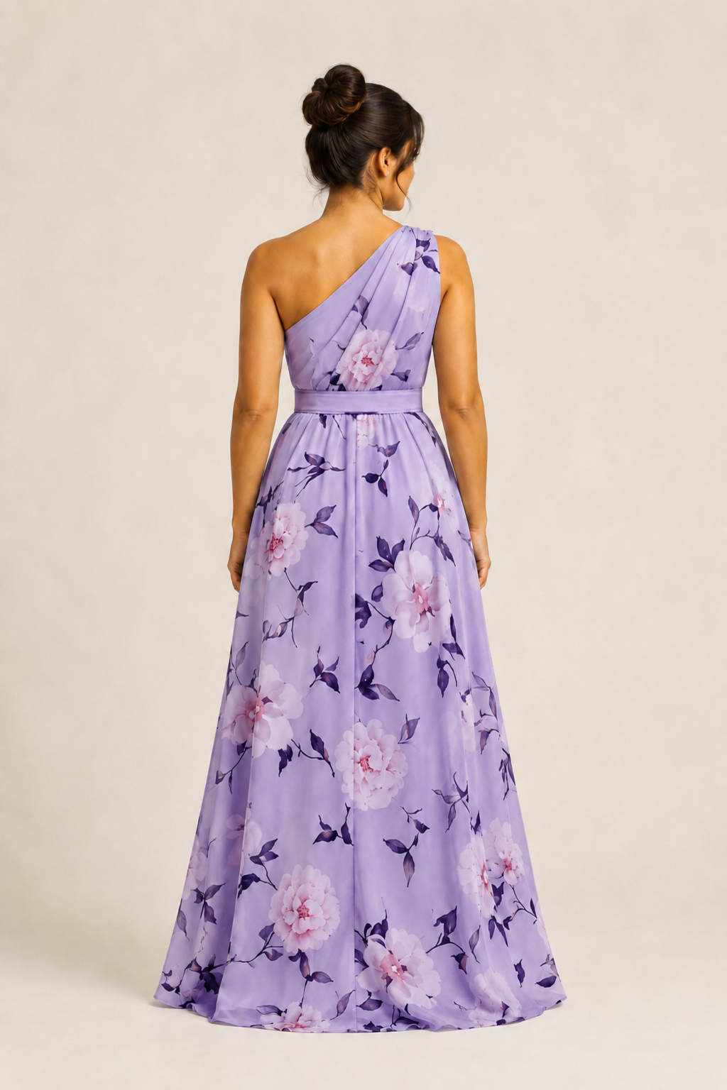 Back view of the purple floral one-shoulder maxi dress showing the asymmetric neckline and full skirt