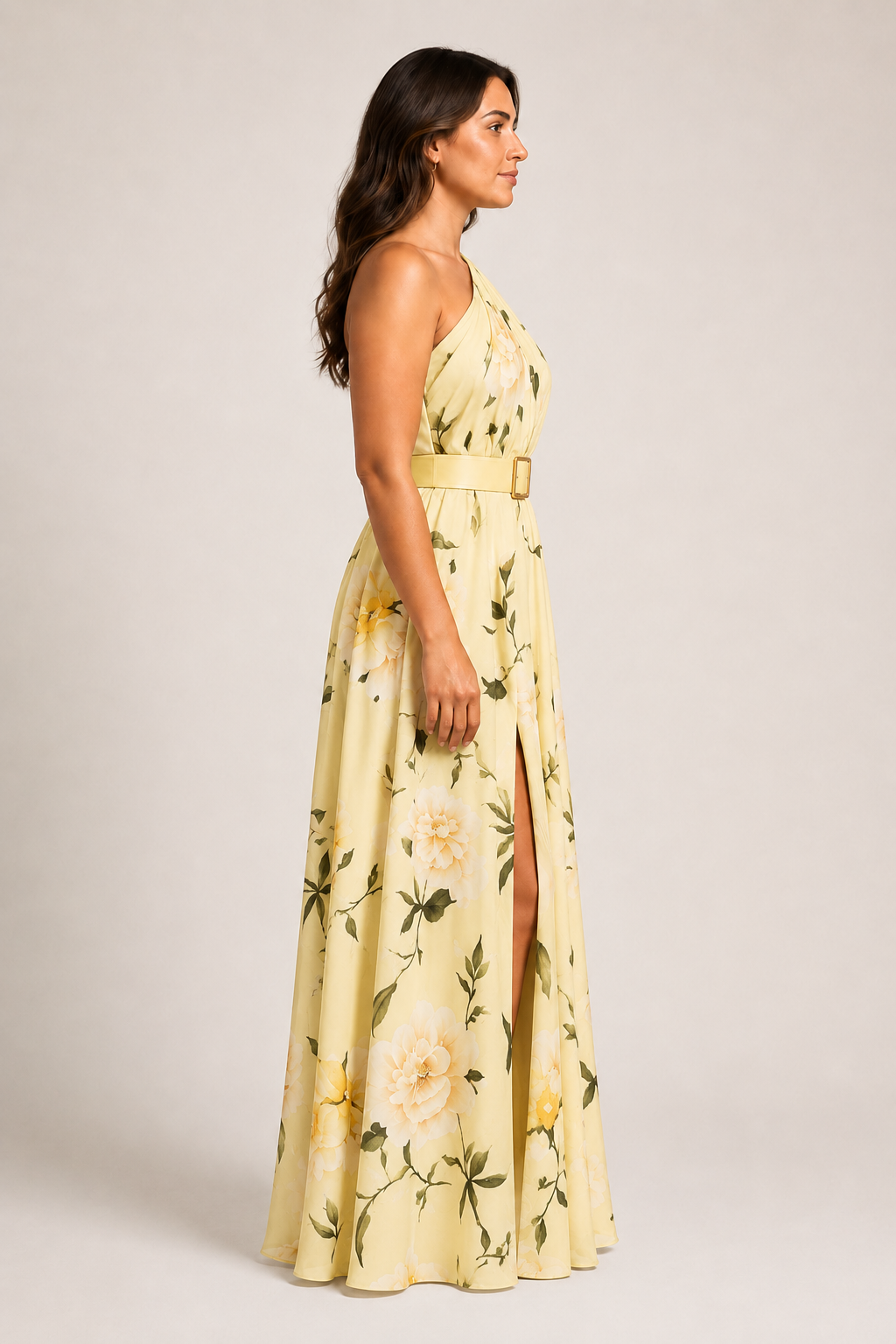 Side view of the yellow floral one-shoulder maxi dress showing the belted waist and front split