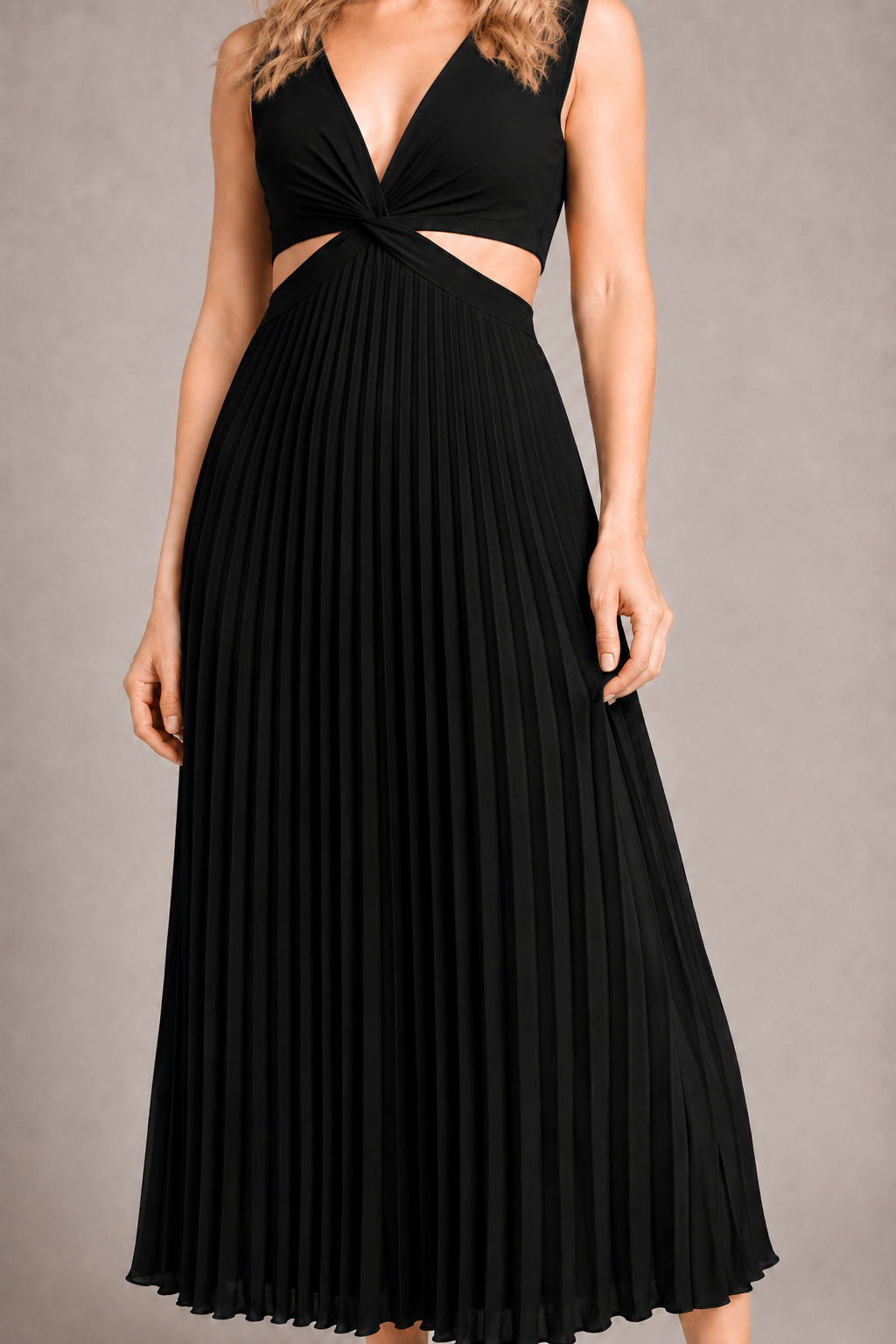 Model-worn close-up of the black dress showing the fine vertical pleats and smooth surface