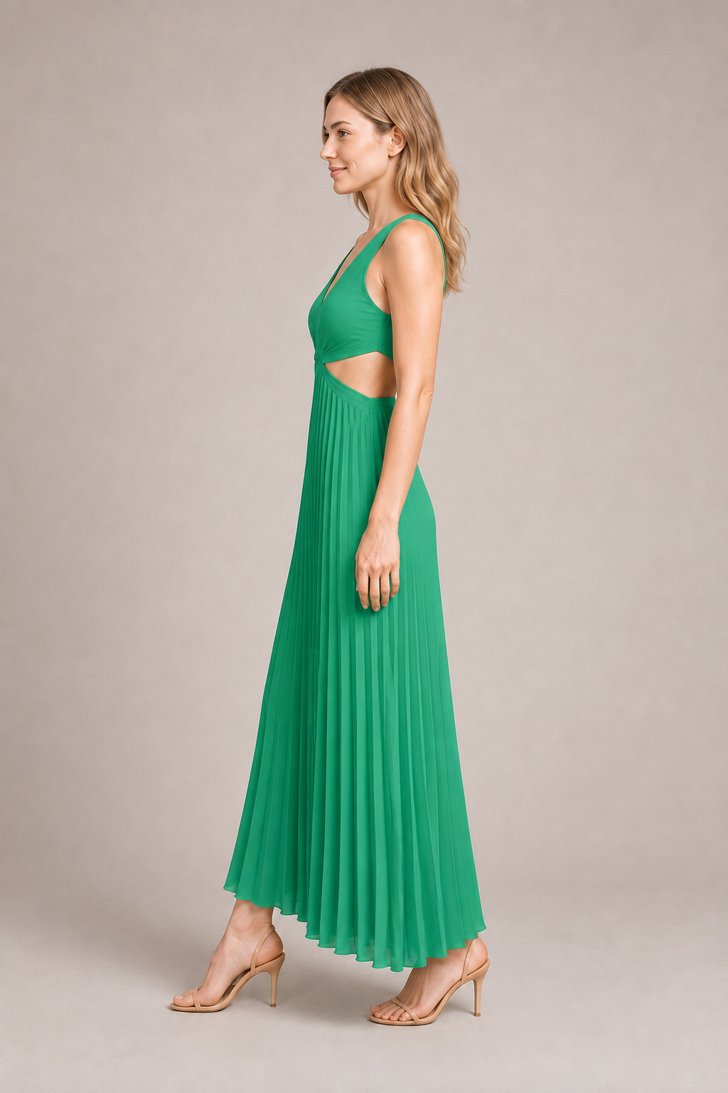 Side view of the green flowing pleated maxi dress