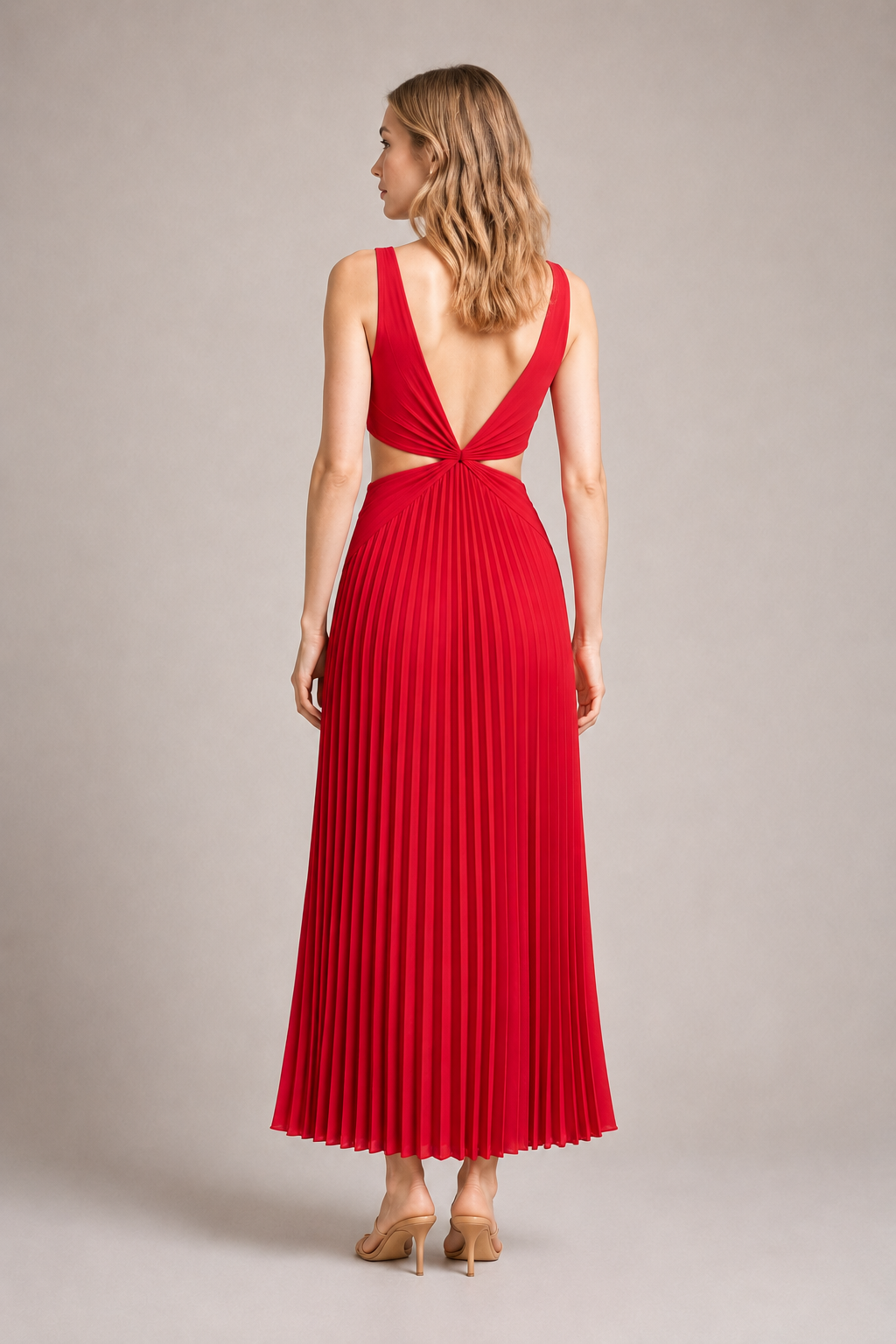Back view of the red flowing pleated maxi dress