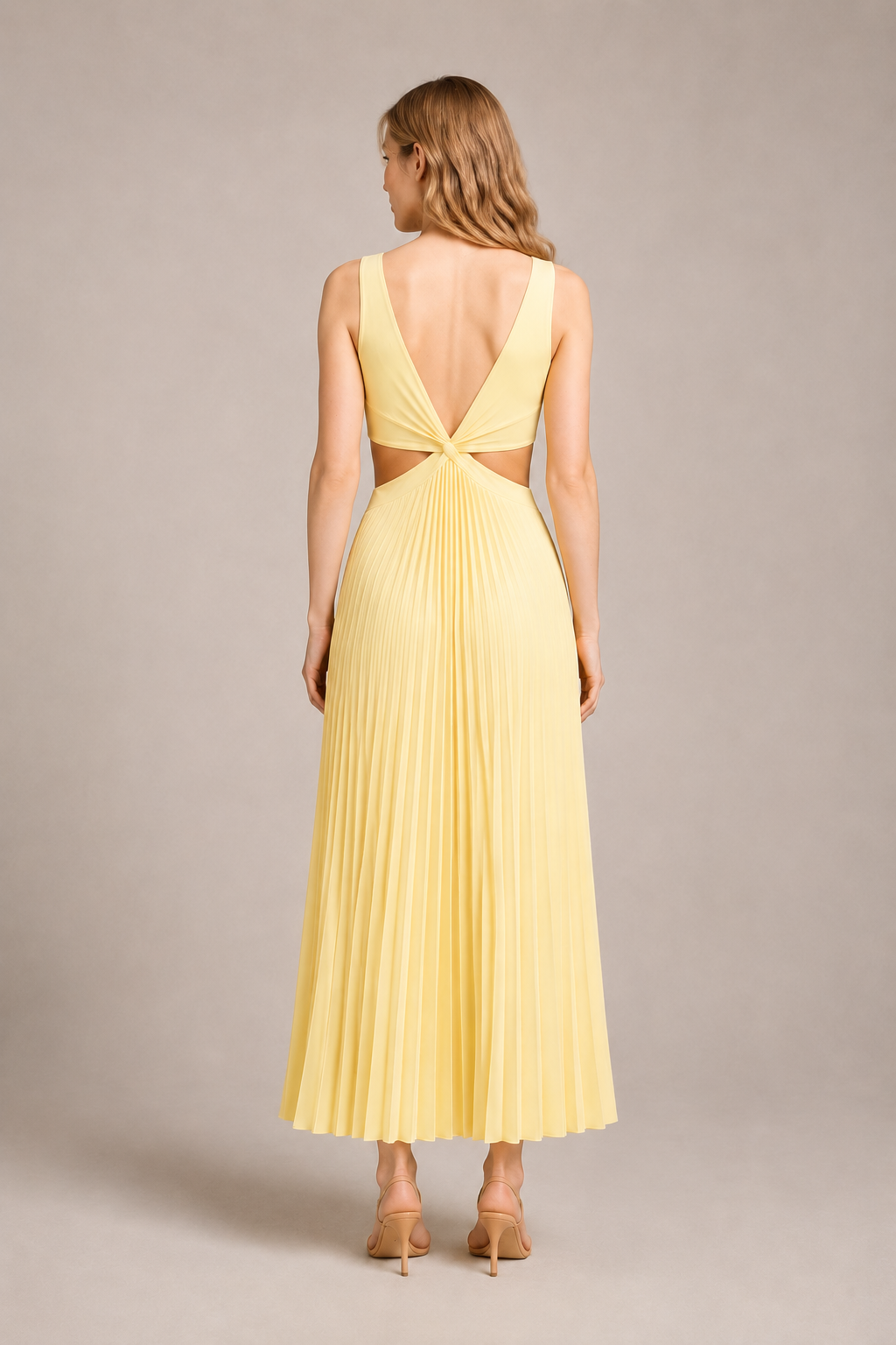 Back view of the yellow flowing pleated maxi dress