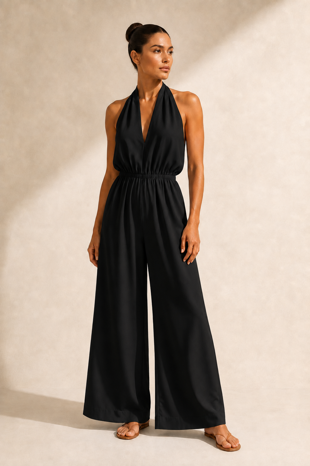 Halter-Neck Cropped Wide-Leg Jumpsuit in Black, front three-quarter view
