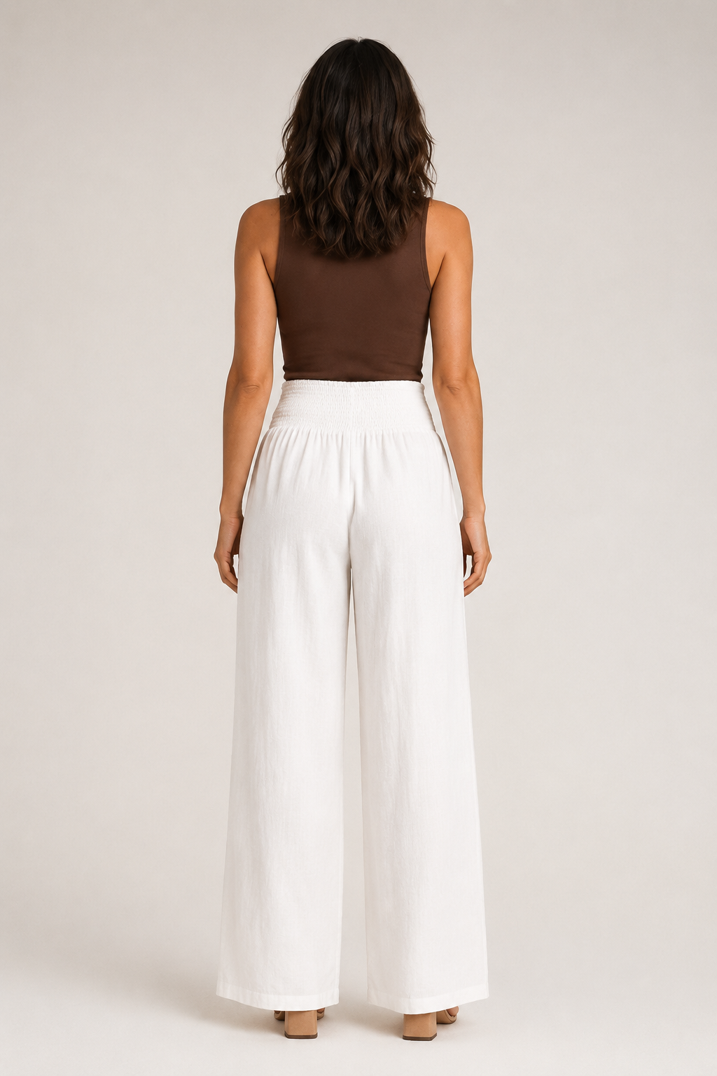 Back view of the white high-waisted palazzo trousers