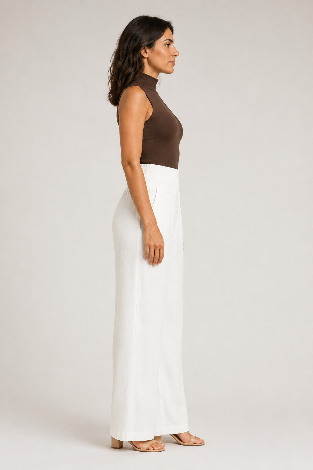 Side view of the white high-waisted palazzo trousers