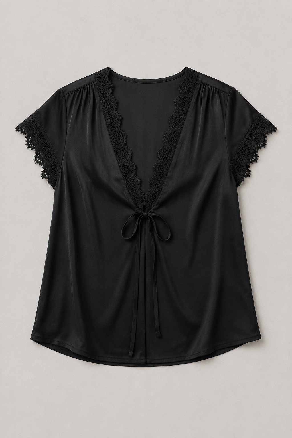 Black lace-trim tie-front blouse flat lay