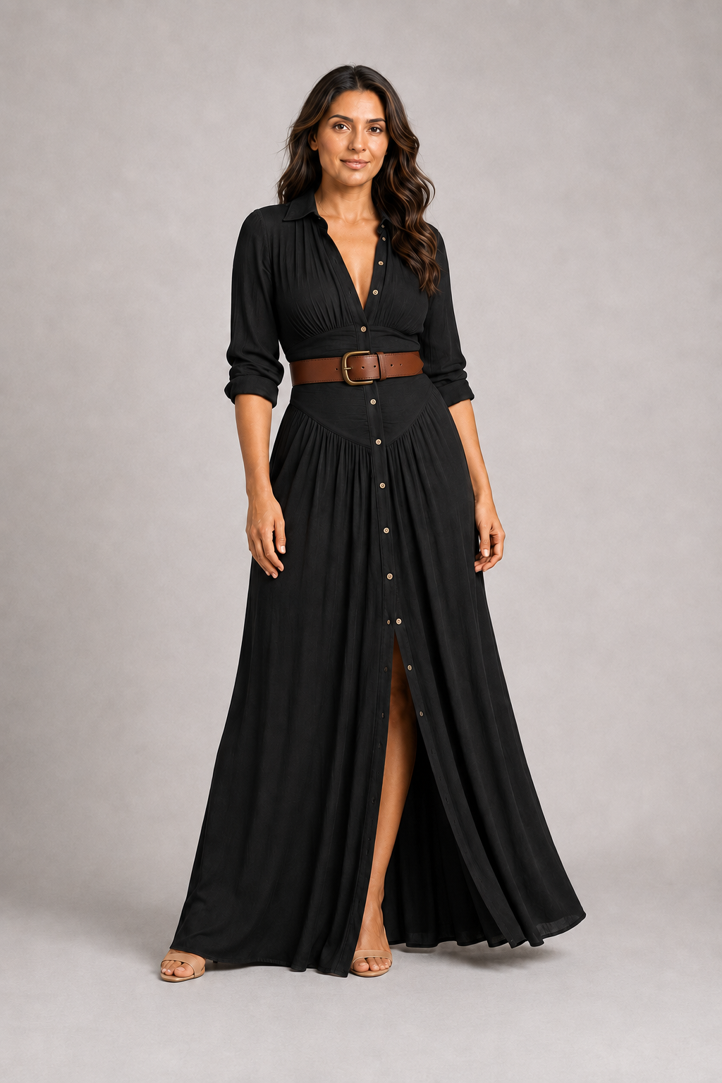 Black notched-collar pleated maxi dress with brown belt, front three-quarter view