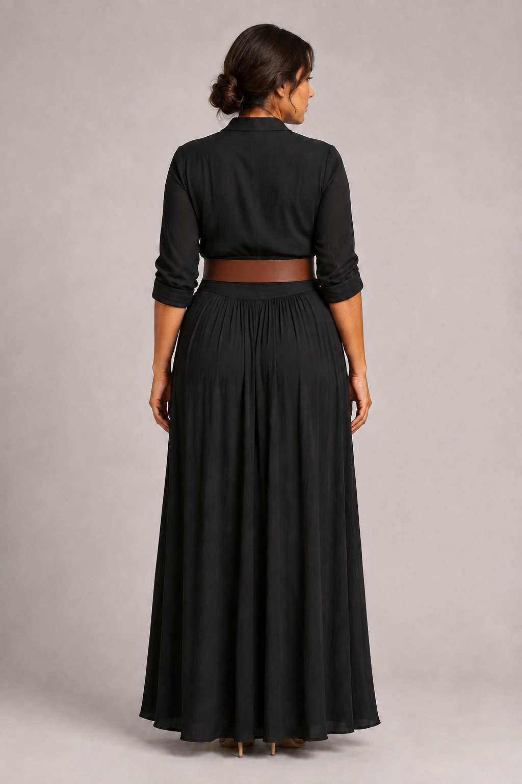 Black notched-collar pleated maxi dress with brown belt, back view