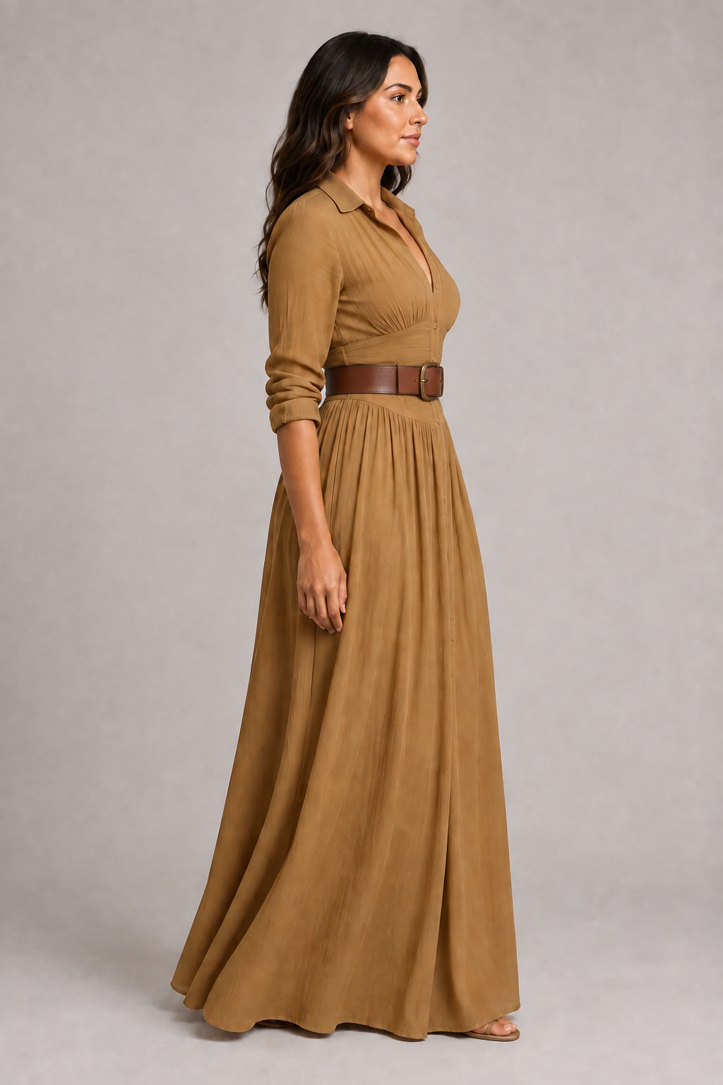 Brown notched-collar pleated maxi dress with darker brown belt, side view