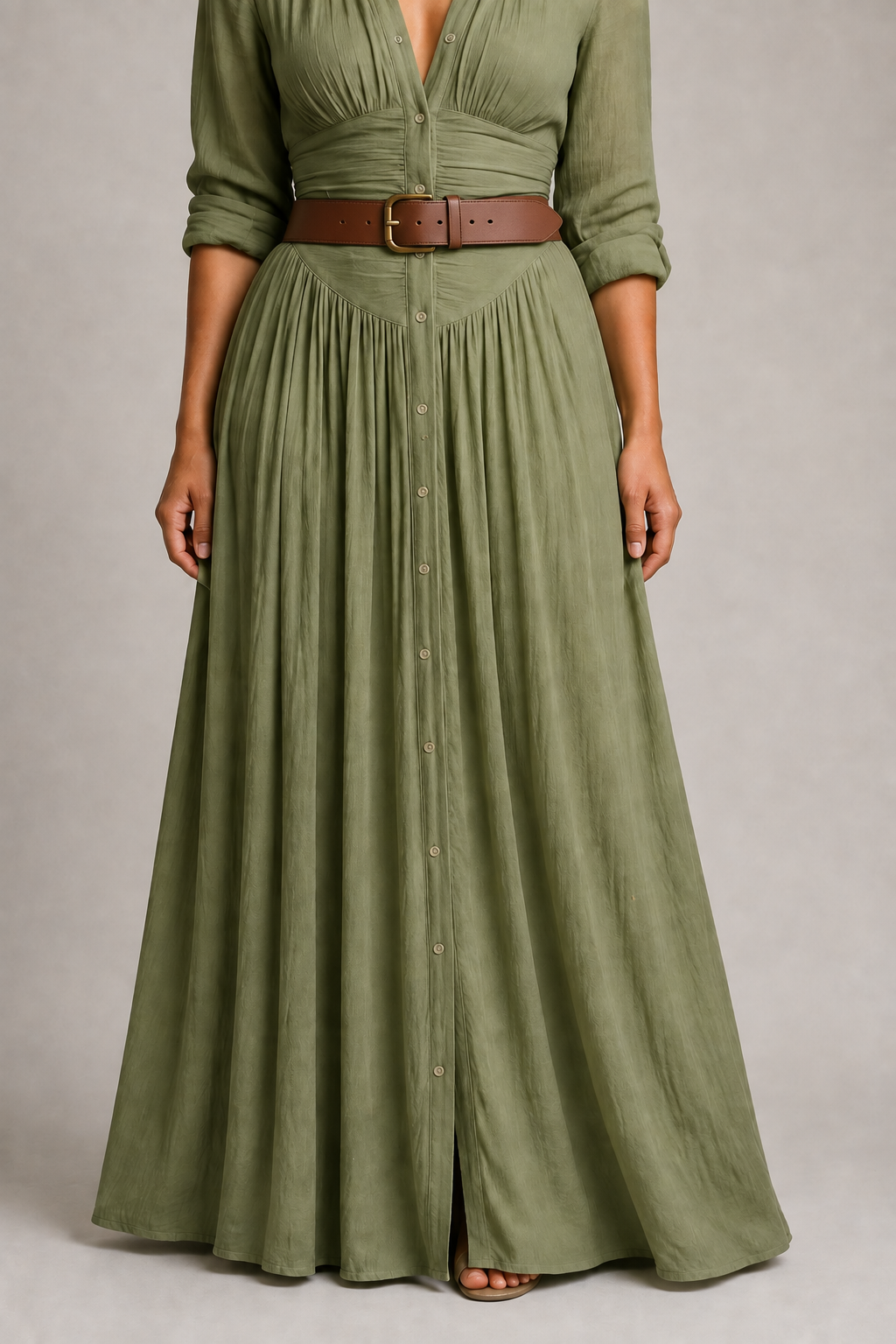 Green pleated maxi dress with brown belt, gathered-skirt fabric and button detail