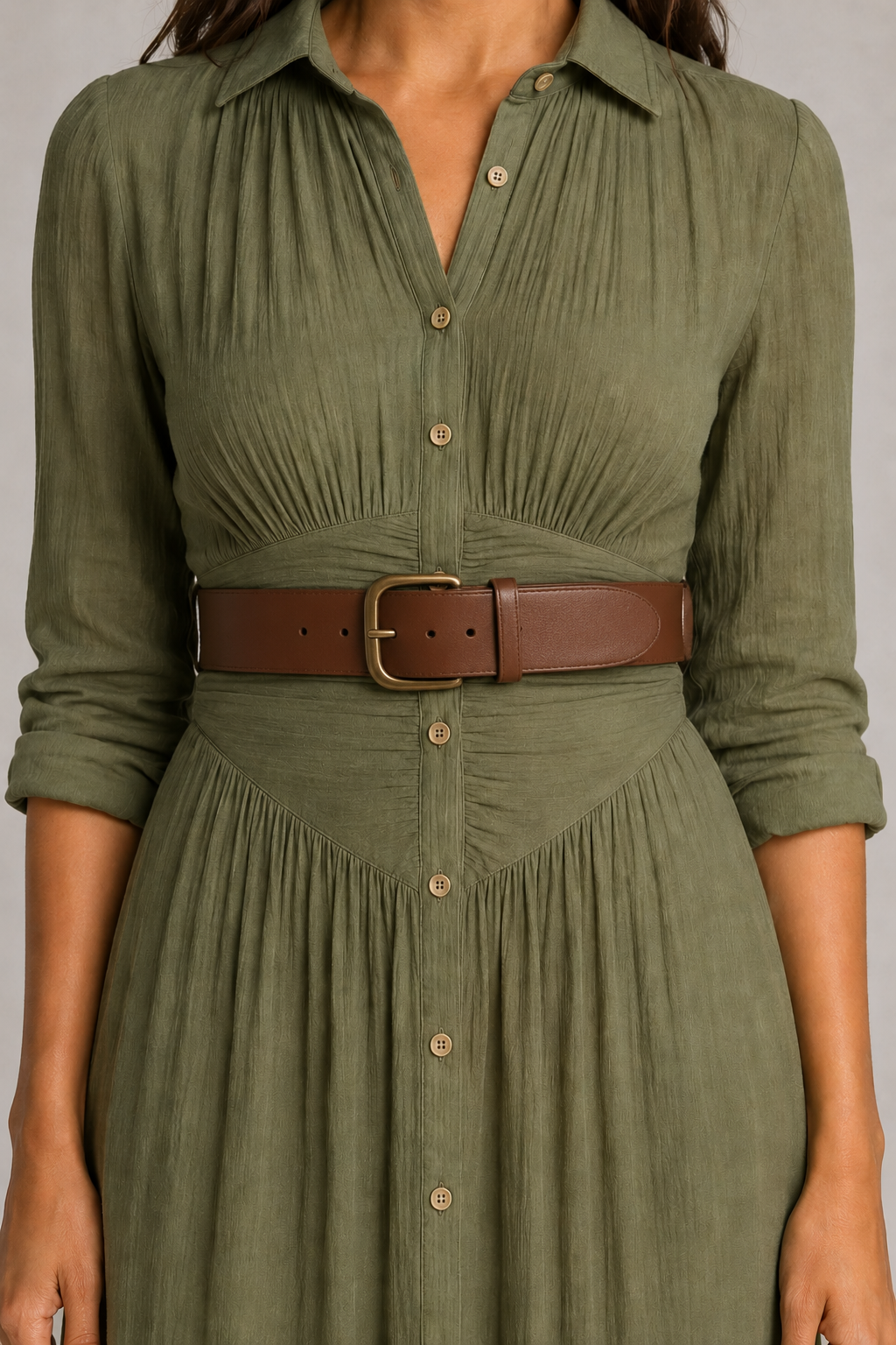 Green pleated maxi dress with brown belt, ruched waist and button-placket detail