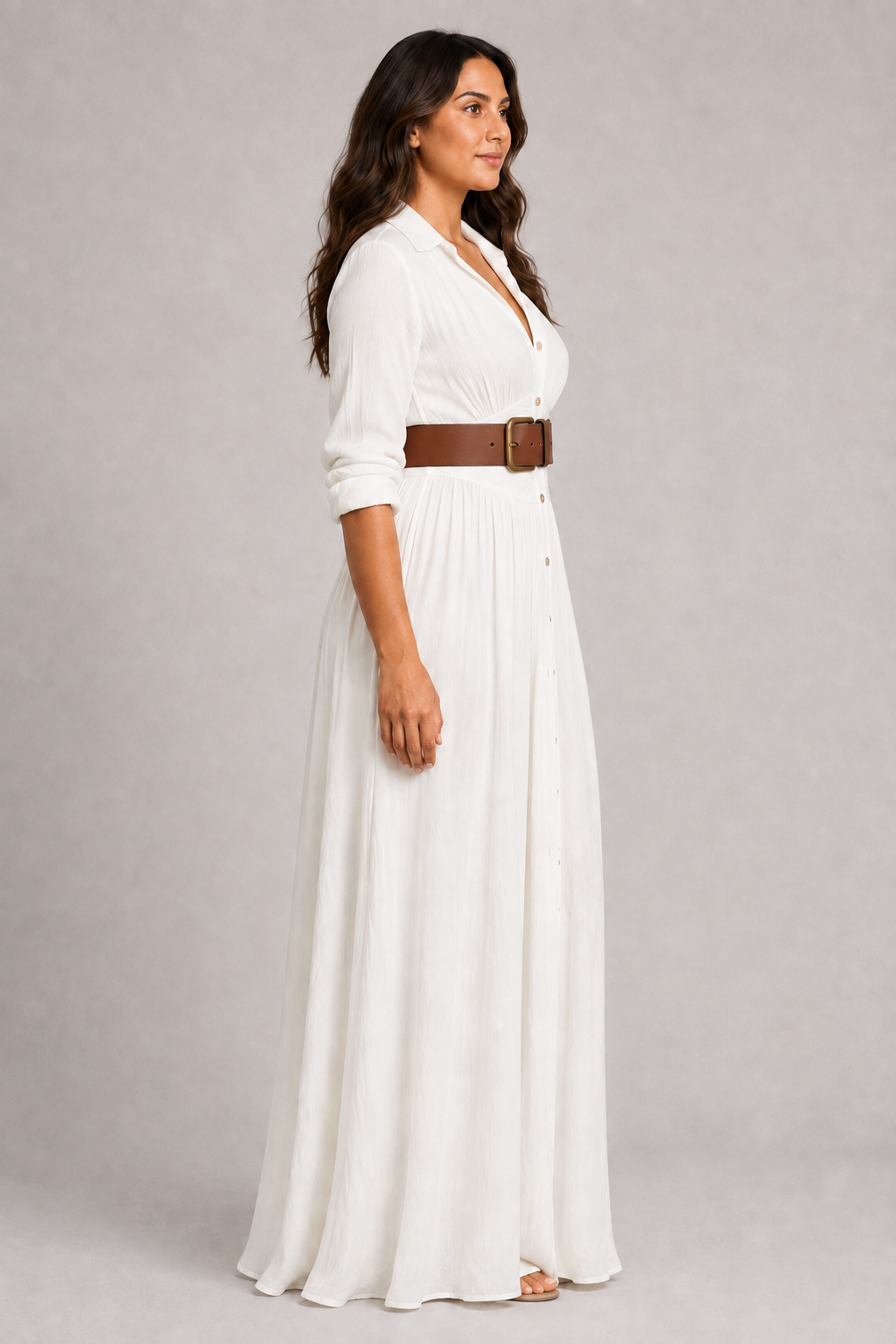 White notched-collar pleated maxi dress with brown belt, side view