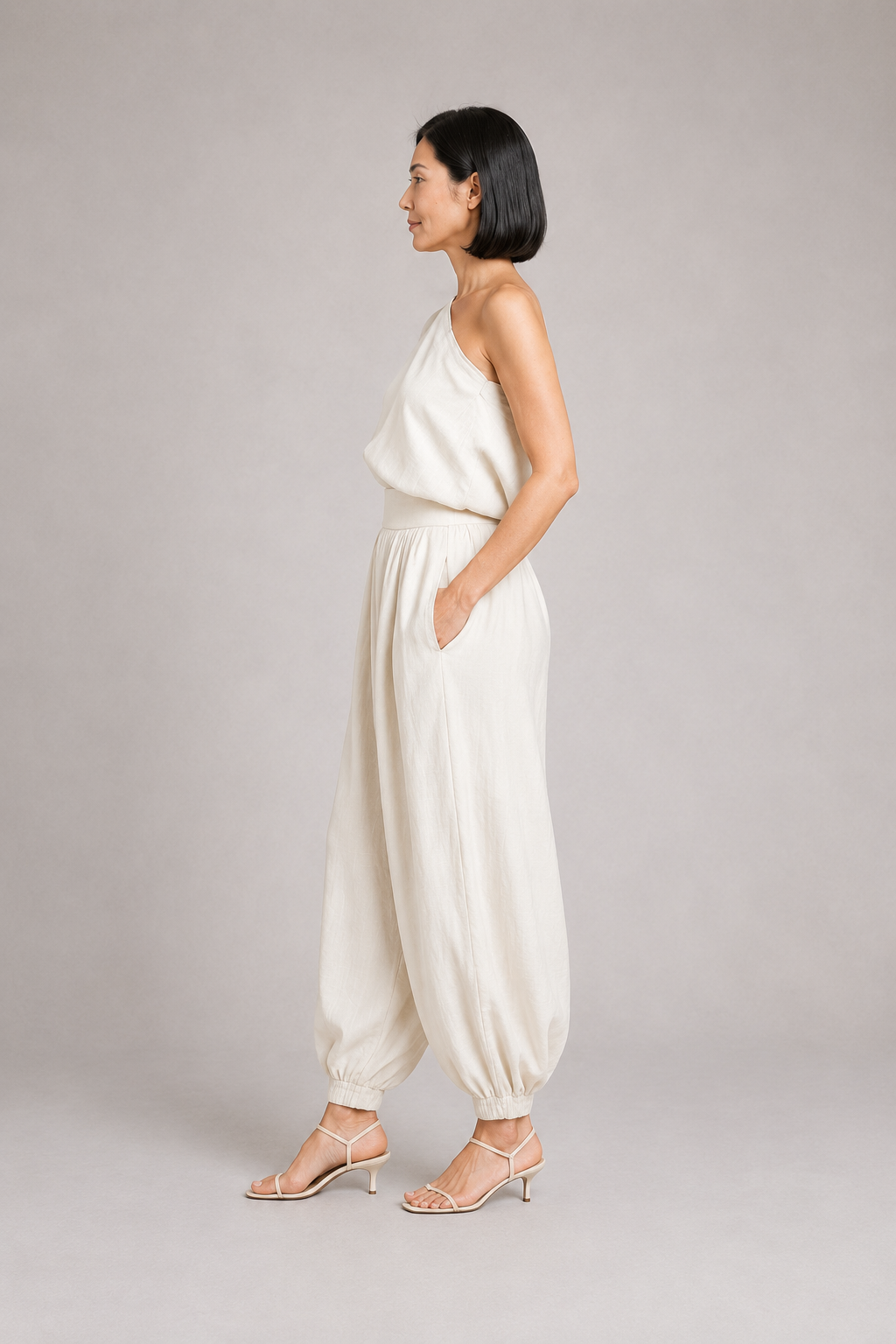 Ivory one-shoulder draped trouser set, side view