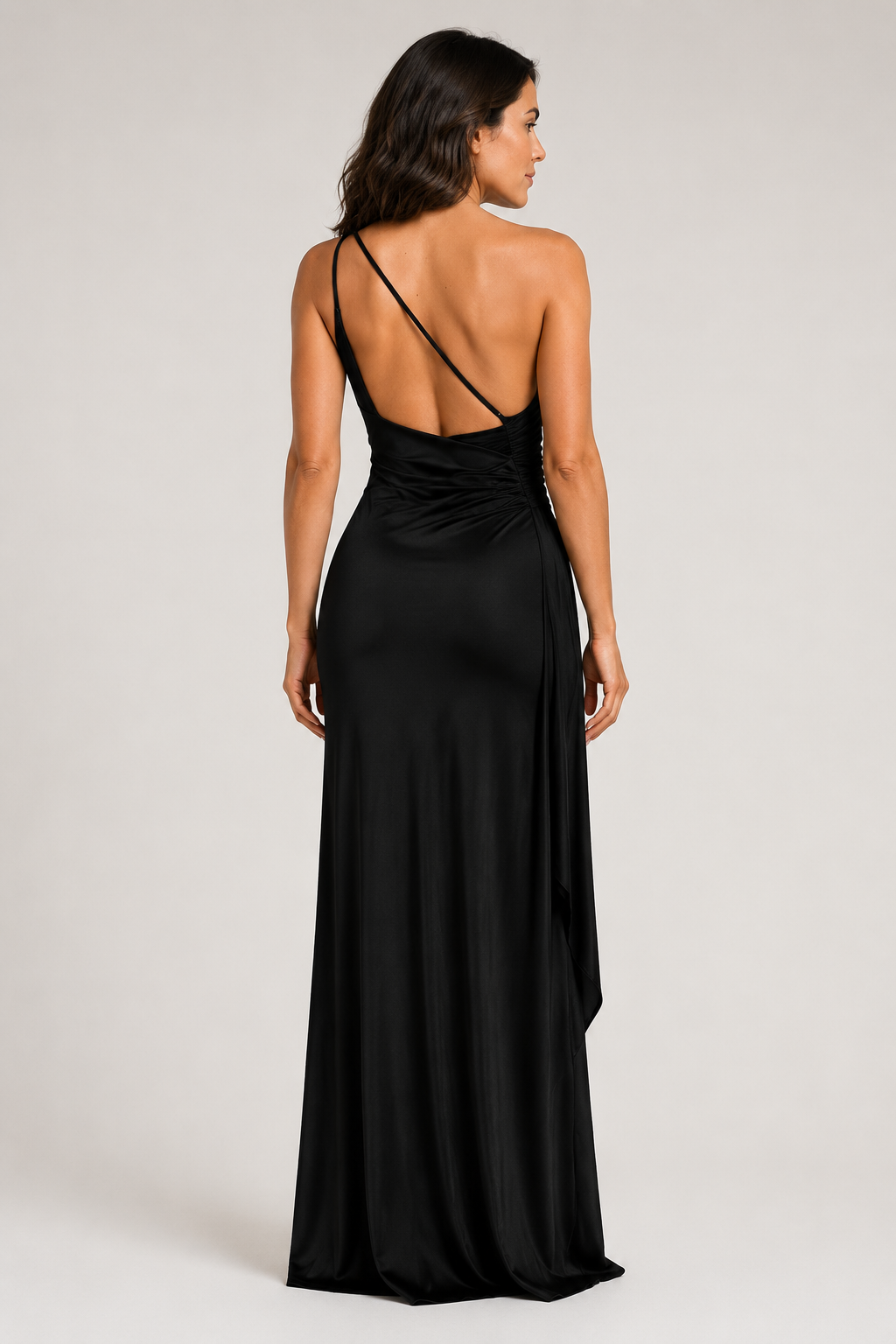 Black one-shoulder flowing maxi dress, open-back strap construction detail