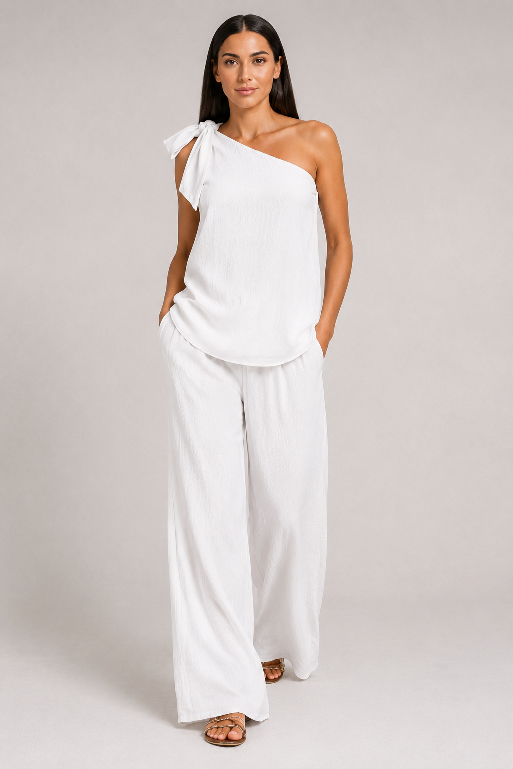 White one-shoulder wide-leg trouser set, front three-quarter view