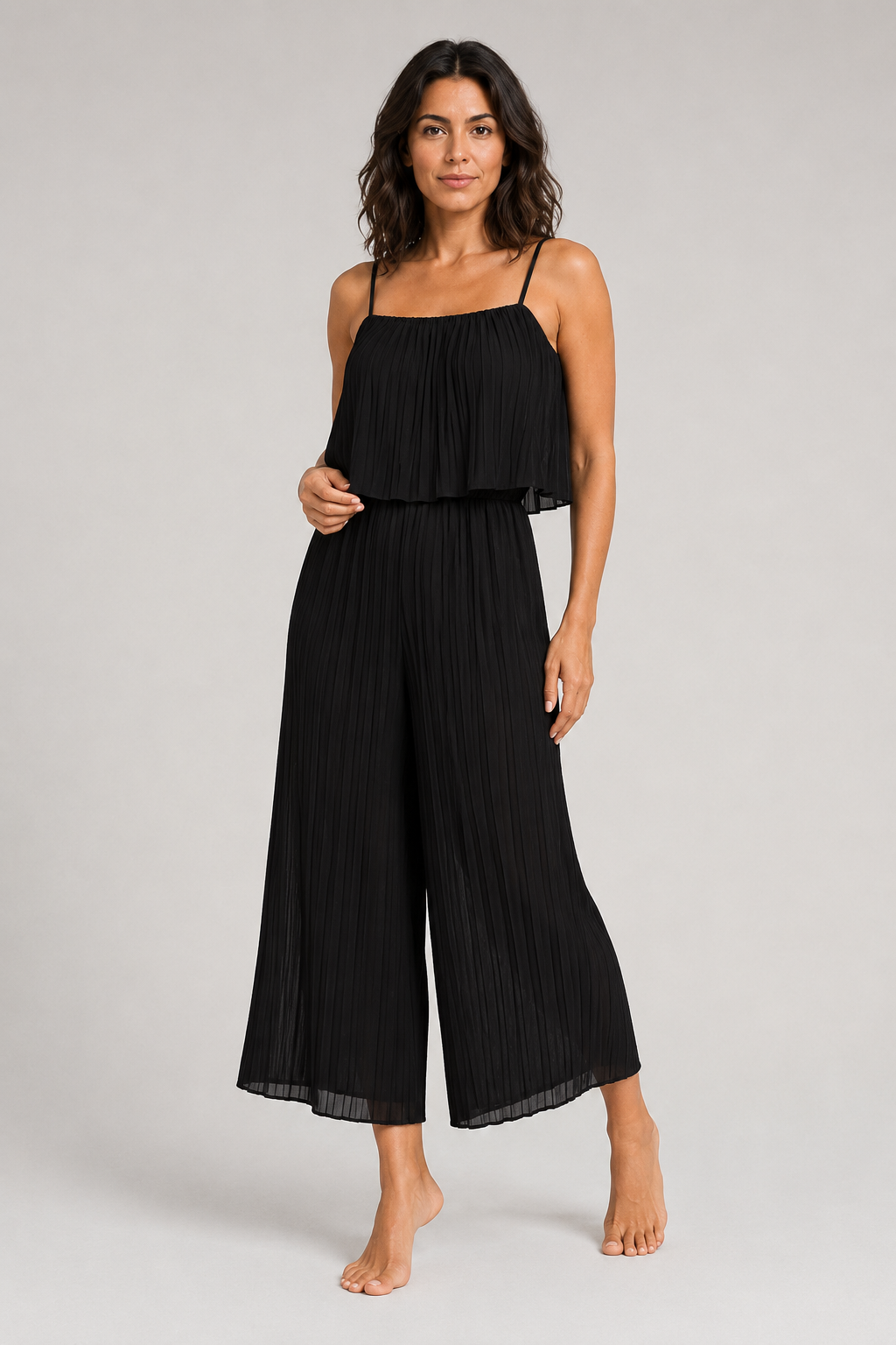 Black pleated wide-leg jumpsuit, front three-quarter view