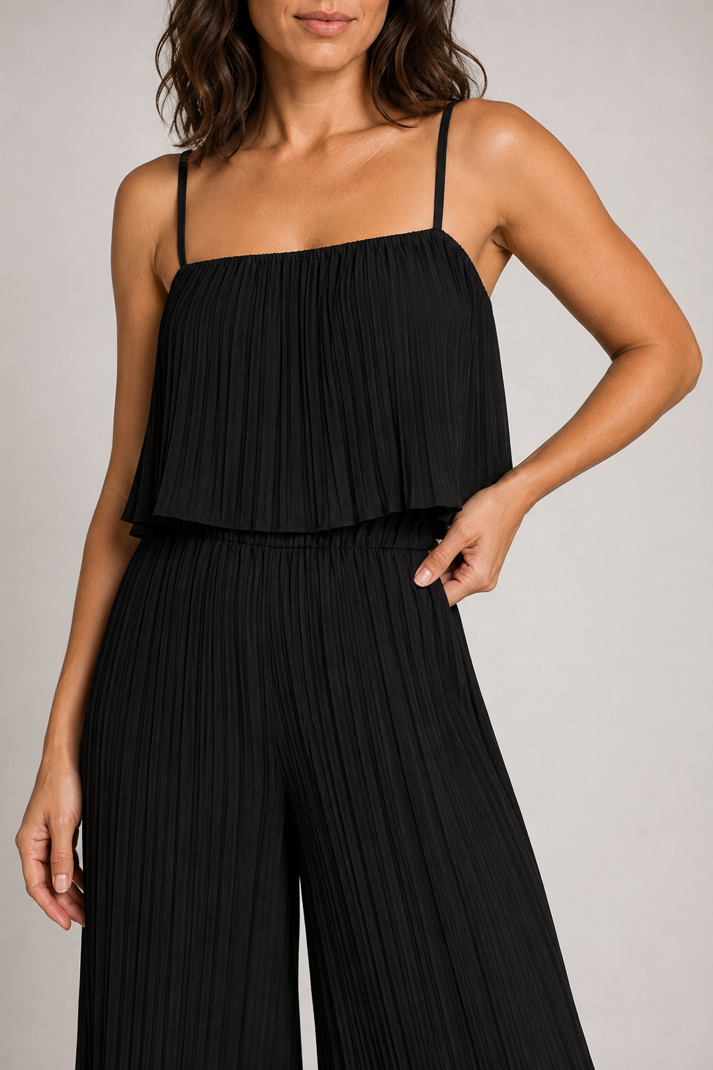 Black pleated wide-leg jumpsuit, waistband construction detail