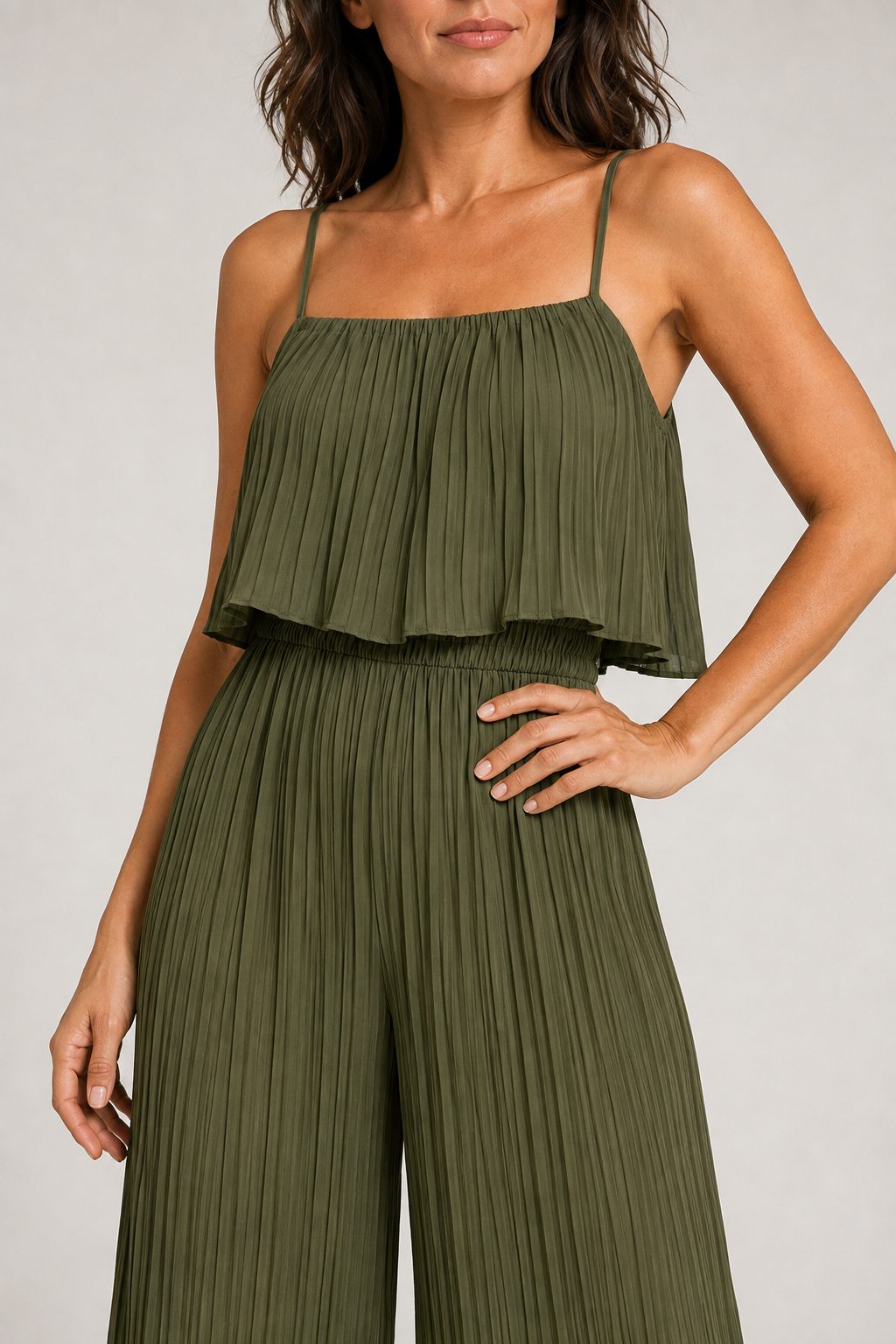 Green pleated wide-leg jumpsuit, waistband construction detail