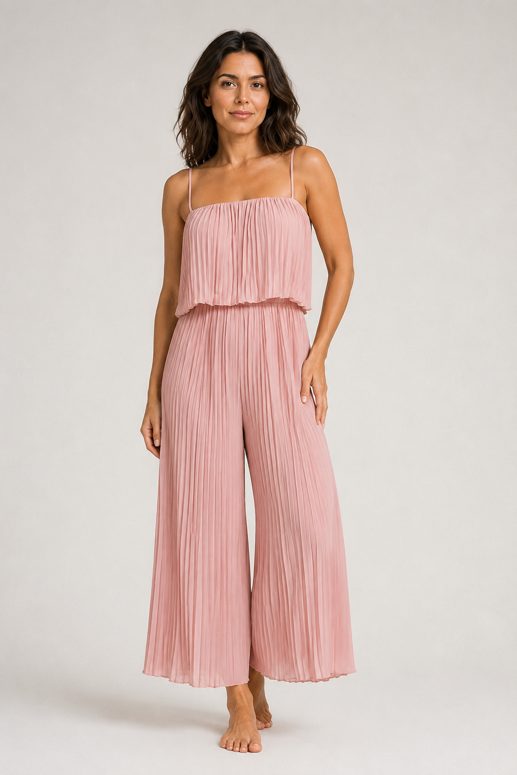 Pink pleated wide-leg jumpsuit, front three-quarter view