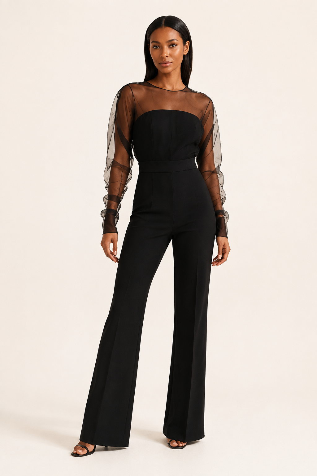Black sheer-sleeve wide-leg jumpsuit, front three-quarter view