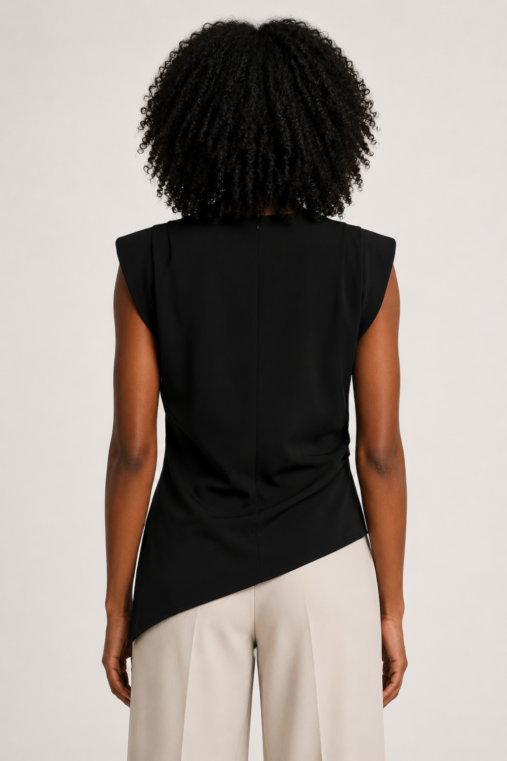 Black sleeveless draped asymmetric top, back view