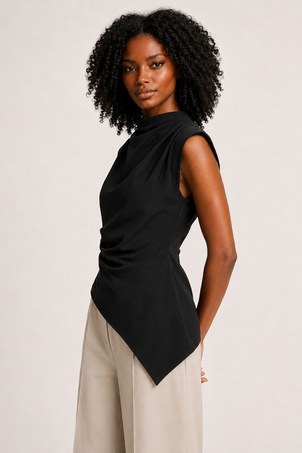 Black sleeveless draped asymmetric top, side view