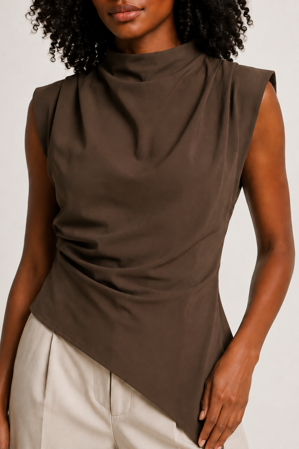 Brown sleeveless draped asymmetric top, model-worn fabric detail