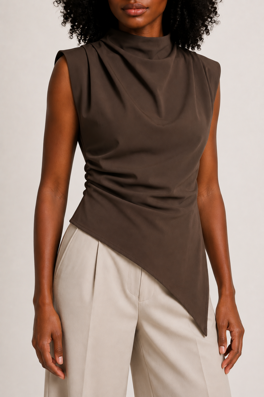 Brown sleeveless draped asymmetric top, ruched waist and asymmetric hem construction detail